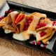 Pancakes with condensed milk and red currants